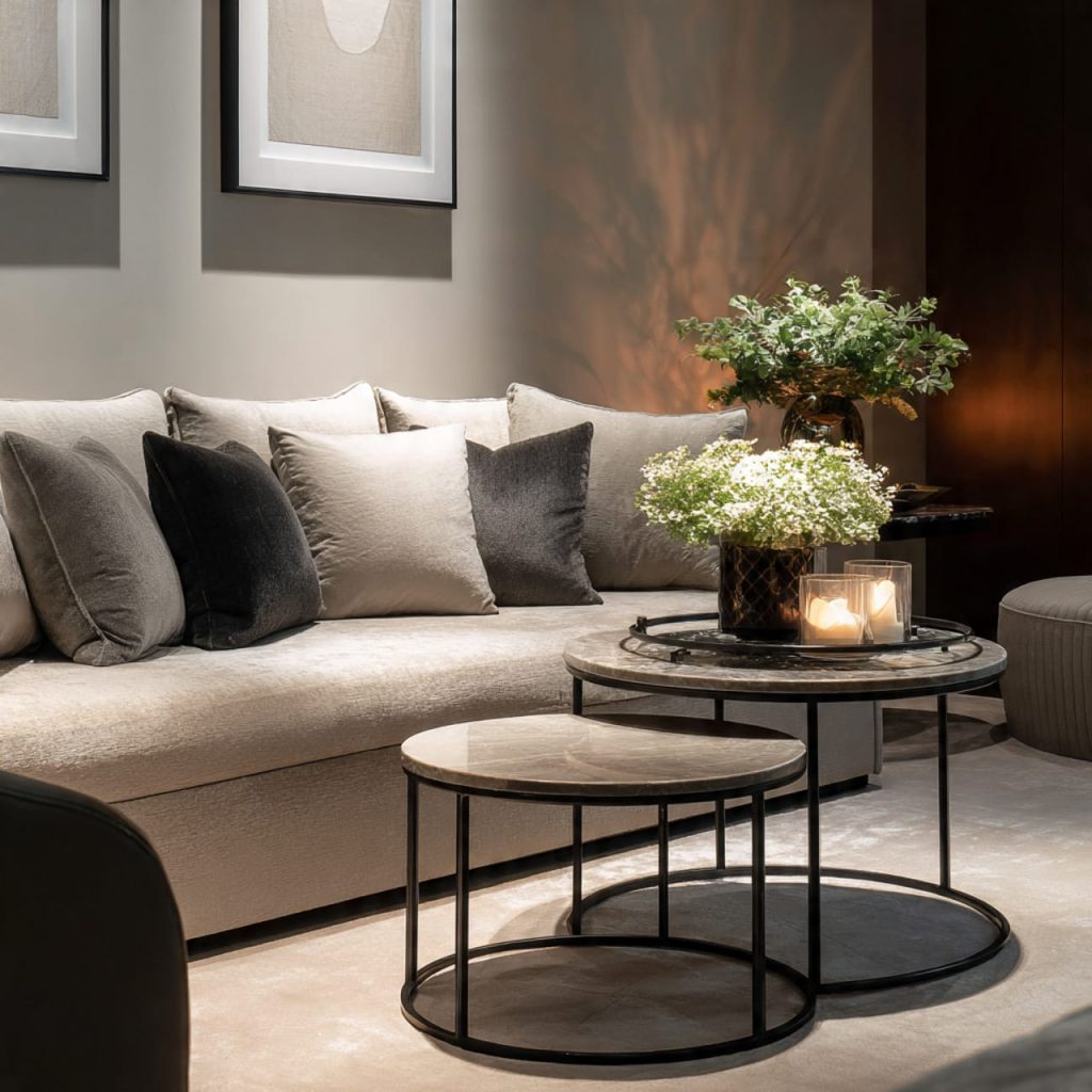 Nest of round coffee tables saving space in a small modern luxury living room
